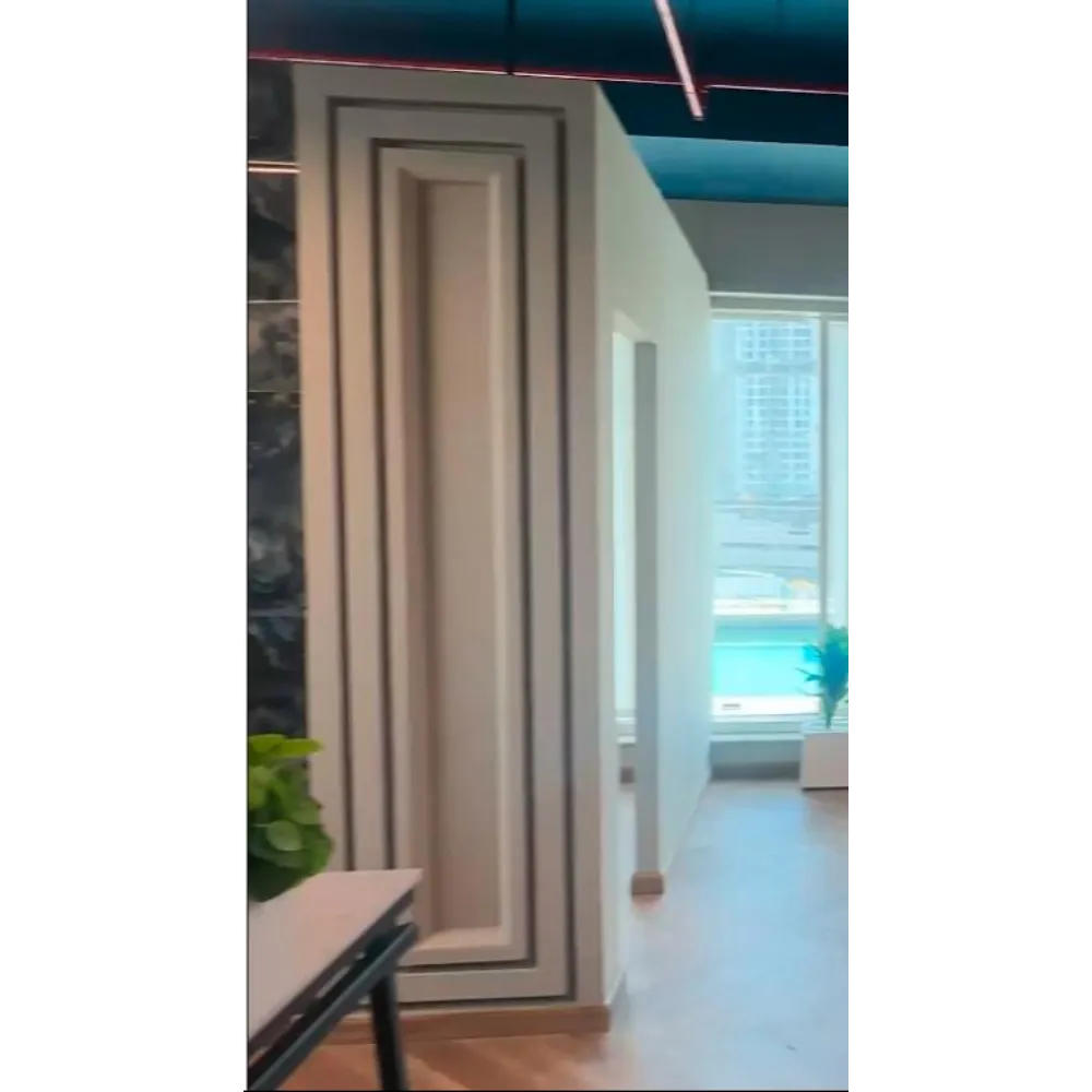 Office interior showcasing modern gypsum partition with Arabic accent design, featuring elegant wall detailing and natural lighting, emphasizing Hausfit's renovation expertise.