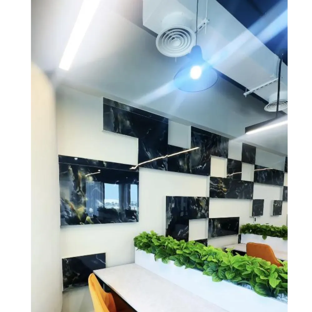 Premium decorative wall design featuring modern black marble panels and integrated greenery, enhancing office aesthetics and functionality.